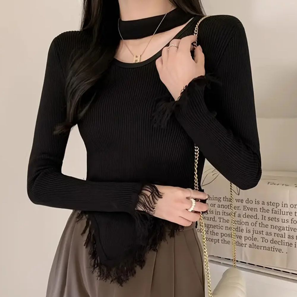 Norellia – Veelzijdige damestrui met speels kwastjesdetail