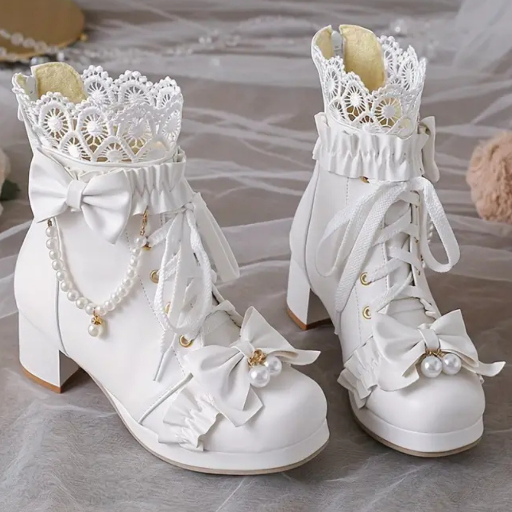 Velarisse – elegante dameslaarzen met strikdetail en verfijnde afwerking