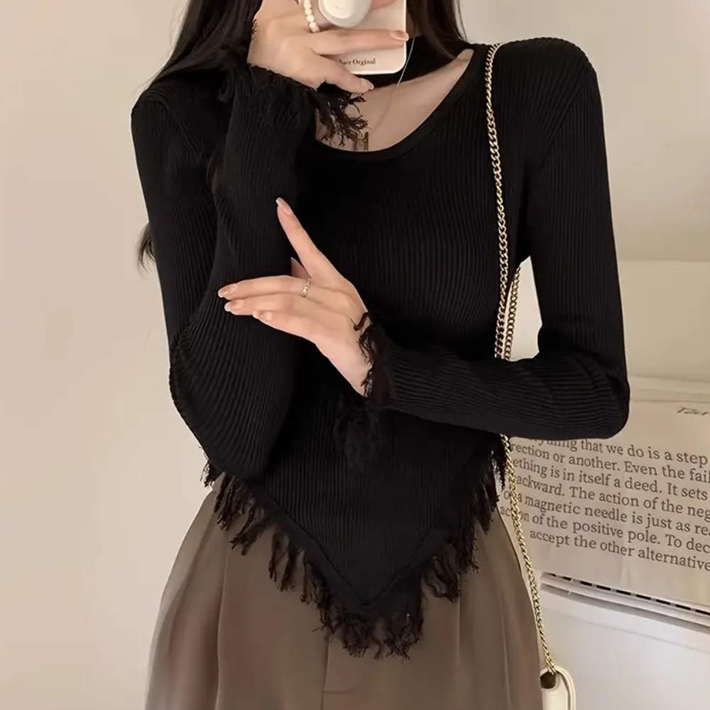 Norellia – Veelzijdige damestrui met speels kwastjesdetail